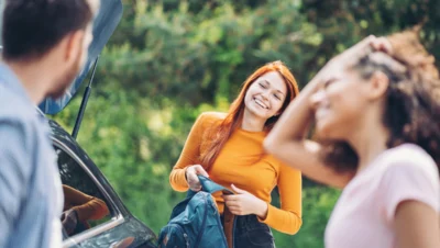 Group of young people on a trip by car