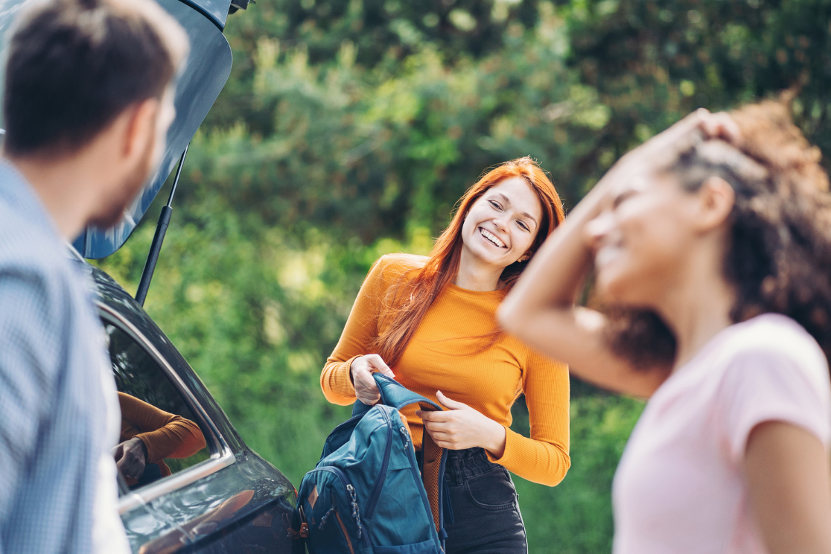 Group of young people on a trip by car